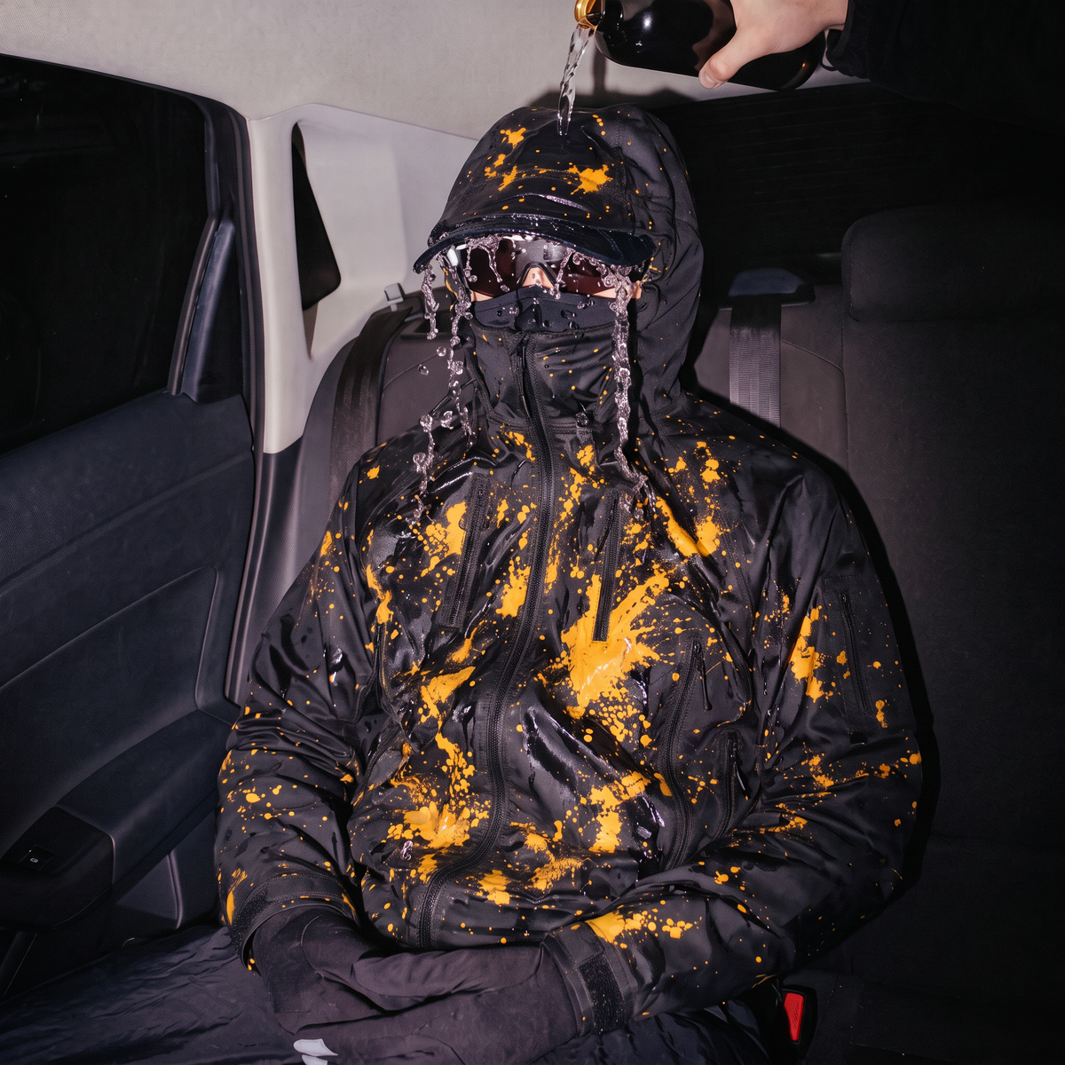 Close view of the jacket hood, zipper and colour-changing shell